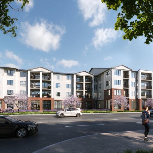 a street with cars and people walking on it and a building in the background